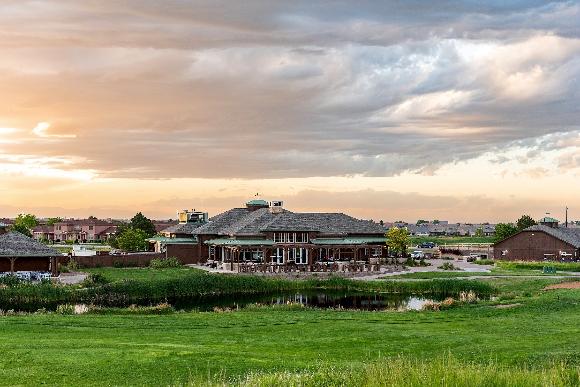Buffalo Run clubhouse with water feature at evening