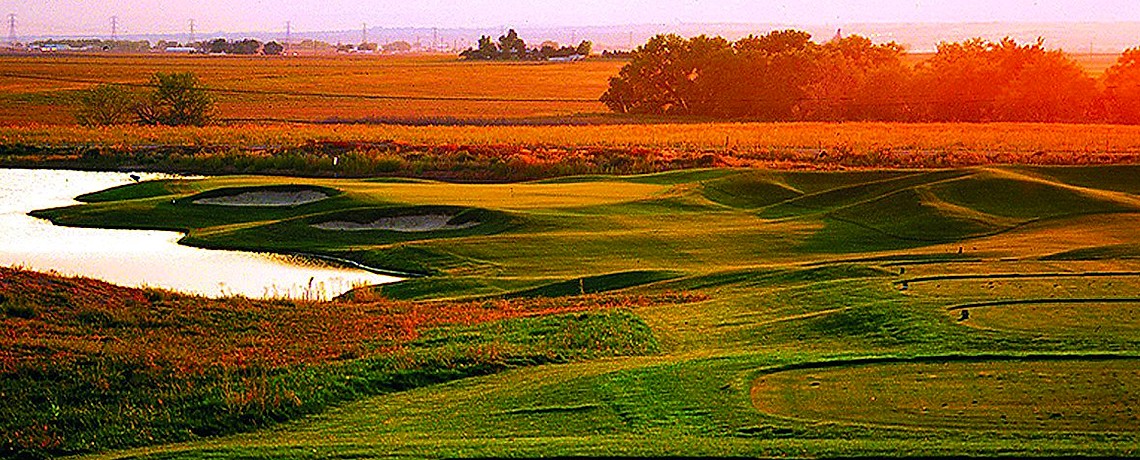 Sunset over Buffalo Run fairway with water feature